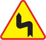 Znak A4 Niebezpieczne zakręty - pierwszy w lewo